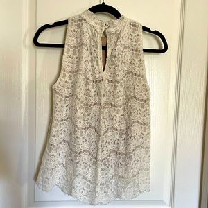 Lace top with coverage layer on the bottom. Nice details on neck buttons.